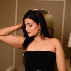 Divya Pillai Looks Elegant in a Black Strapless Jumpsuit