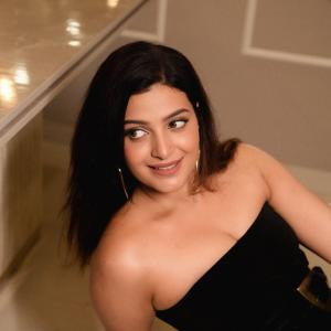 Divya Pillai Looks Elegant in a Black Strapless Jumpsuit