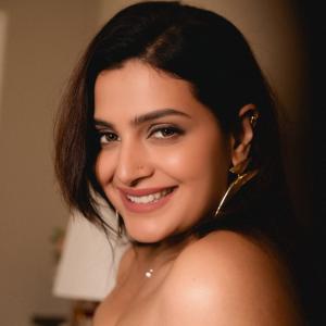 Divya Pillai Looks Elegant in a Black Strapless Jumpsuit