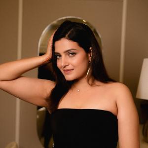 Divya Pillai Looks Elegant in a Black Strapless Jumpsuit
