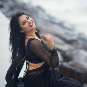 Prisha Singh Stuns in Elegant Black Saree by the Seaside