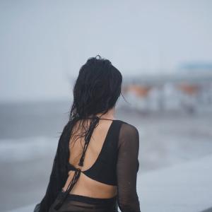 Prisha Singh Stuns in Elegant Black Saree by the Seaside