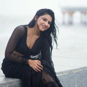 Prisha Singh Stuns in Elegant Black Saree by the Seaside