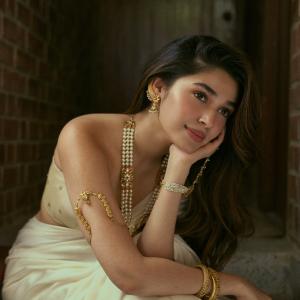 Kriti Shetty Stuns in Elegant Ivory Saree and Pearl Jewelry