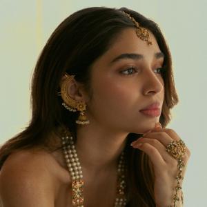 Kriti Shetty Stuns in Elegant Ivory Saree and Pearl Jewelry