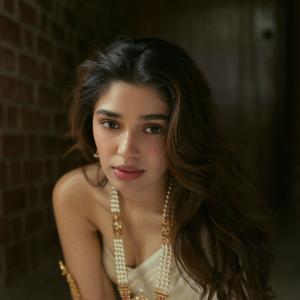 Kriti Shetty Stuns in Elegant Ivory Saree and Pearl Jewelry