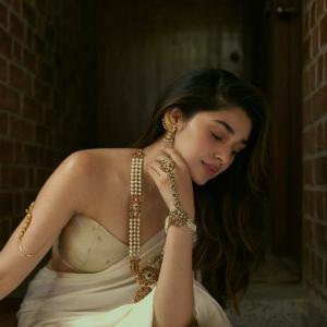 Kriti Shetty Stuns in Elegant Ivory Saree and Pearl Jewelry