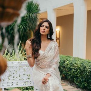 Actress Malavika Mohanan Looks Elegant in Ivory White Saree