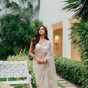 Actress Malavika Mohanan Looks Elegant in Ivory White Saree