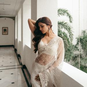 Actress Malavika Mohanan Looks Elegant in Ivory White Saree