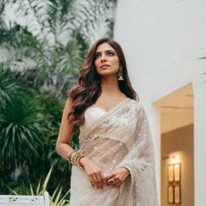 Actress Malavika Mohanan Looks Elegant in Ivory White Saree