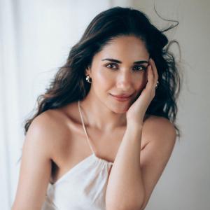 Actress Ruhani Sharma Looks Elegant in White Sleeveless Outfit
