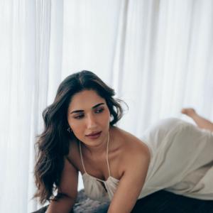 Actress Ruhani Sharma Looks Elegant in White Sleeveless Outfit