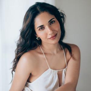 Actress Ruhani Sharma Looks Elegant in White Sleeveless Outfit
