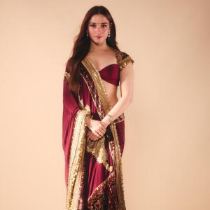 Tamanna Bhatia Stuns in Elegant Maroon and Gold Saree