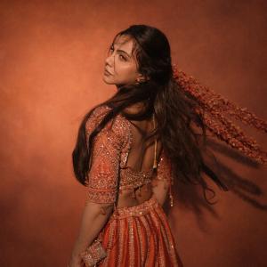 Madonna Sebastian Stuns in a Regal Red Traditional Look
