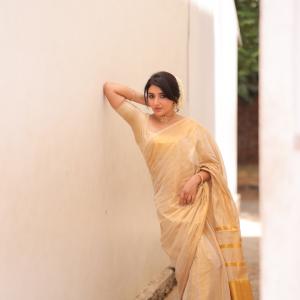 Mirna Menon Shines in Elegant Cream and Gold Saree Look