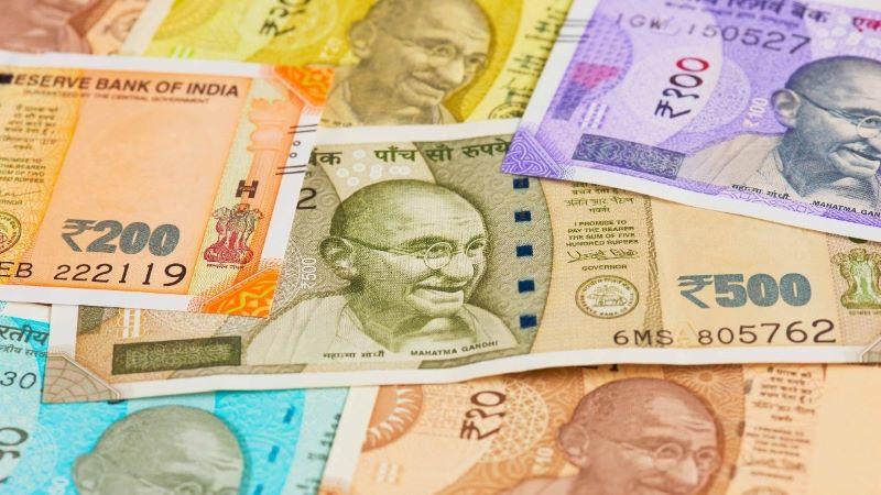 Indian Rupee Weakens to 84.39 Against US Dollar Amid Market Pressures