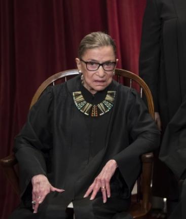 Associate Justice Ruth Bader Ginsburg joins other justices of the U.S. Supreme Court for an official group portrait at the Supreme Court Building in Washington, Thursday. June 1, 2017. The oldest sitting justice at age 84, Ginsburg was appointed by…