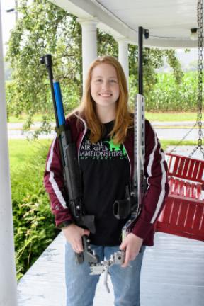 Fifteen-year-old Sarah Frantz holds her air rifle and smallbore rifle. The Andreas teen was recently named third in the nation by the National Rifle Association in smallbore competition in the 14-17 category. AMY MILLER/TIMES NEWS