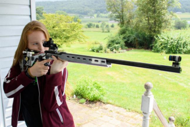 Sarah Frantz, 15, of Andreas, shows how to properly hold a smallbore rifle.
