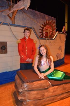 Nolan Rehrig as Prince Eric and Brooke McElmoyle as Ariel, pose next to the prince's ship during dress rehearsal for "The Little Mermaid." KAREN CIMMS/TIMES NEWS