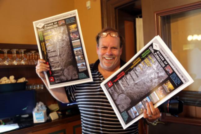 Tamaqua native Scott Herring, chairman of the Anthracite 250th Anniversary, unveils promotional materials July 15 at a kickoff dinner at the Tamaqua Train Station Restaurant. DONALD R. SERFASS/SPECIAL TO THE TIMES NEWS