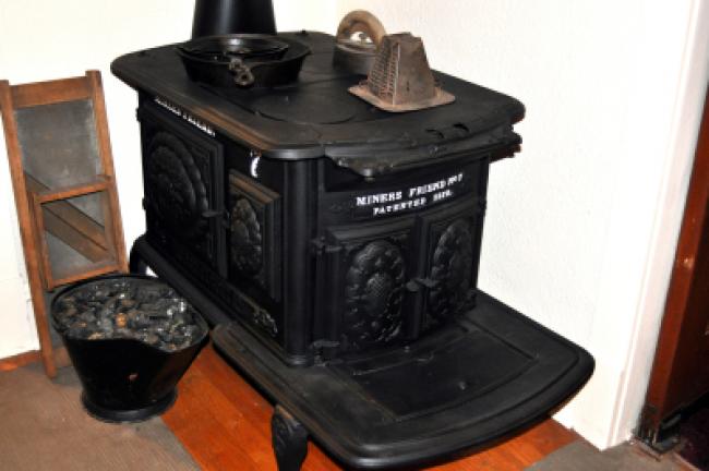 Coal helped to build the nation but also was the center of home life. The fuel could be used for room heating, cooking, warming bath water, toasting bread and heating the flat iron, some of which is suggested by this display at the Lansford…