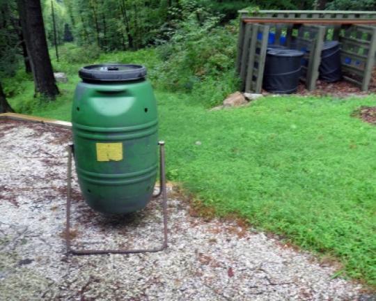 A barrel composter near Eileen East's garden.