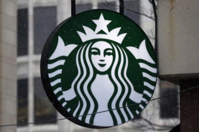 This is the Starbucks logo on a shop in downtown Pittsburgh Tuesday, March 14, 2017. (AP Photo/Gene J. Puskar) Copyright - Copyright 2017 The Associated Press. All rights reserved.