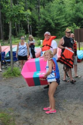 Addison Miller and Sam Echevarria of Halifax prepare to launch their cardboard boat during a recent event at Sweet Arrow Lake County Park. LISA PRICE/SPECIAL TO THE TIMES NEWS