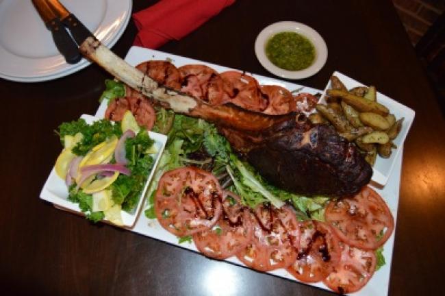 Tomahawk steak is ready to be served.