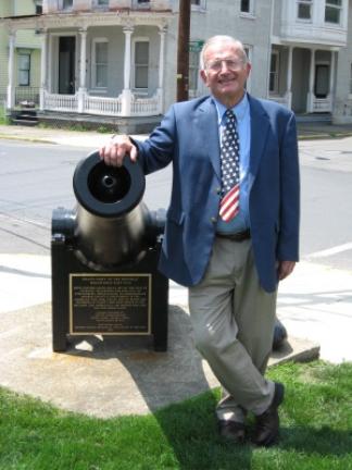 Jim Werkheiser with one of the cannons at Courthouse Square. CONTRIBUTED PHOTO