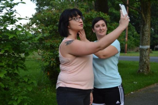 Lisa Hopstock directs Marissa Miller to lift her chin slightly for a more flattering selfie.