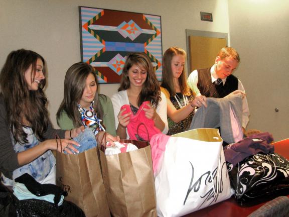 STACEY SOLT/SPECIAL TO THE TIMES NEWS Officers of Lehighton High School's National Honor Society sort clothing collected during their recent clothing drive. Nearly 30 large bags were collected. From left, Erica Wenrich, historian; Madeline Zern,…