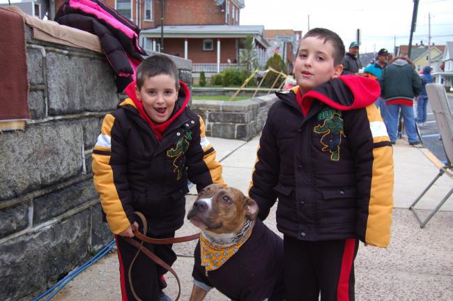 CHRIS PARKER/TIMES NEWS Twins Ty, left, and Logan Graver, with a dressed-up Duke, are eager for Lehighton's 39th Annual Halloween Parade to start. The 5-year-old boys, sons of Scott and Missy Graver of Parryville, attended the parade on Saturday…