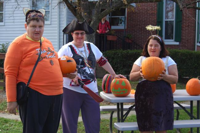 CHRIS PARKER/TIMES NEWS Clients of Spectrum Community Services, Lehighton, had a grand time at aHalloween party Thursday. Costumed guests fromNesquehoning and Lehigh Countydecorated pumpkins, enjoyed snacks and had their facespainted. Here, Mary G…