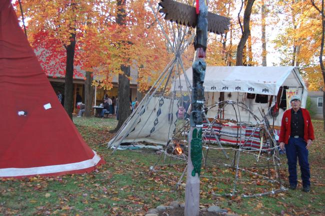 Gary Royer demonstrated several styles of Indian houses. The one near him is an old design that would have been covered by hides or bark.