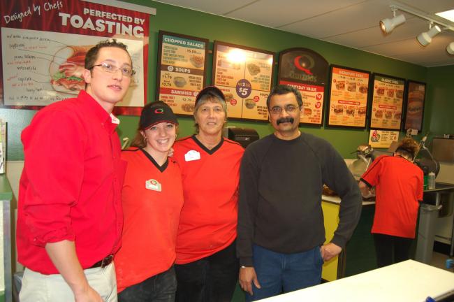 TERRY AHNER/TIMES NEWS Employees at the recently opened Quiznos at 577 Delaware Avenue in Palmerton include (l-r) Chris Darienzo, representative, Cassie Borrell, manager, Faye Techentin, co-manager, and Nilesh Patel, Sunoco gas station store manager.