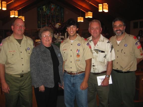 LIZ PINKEY/SPECIAL TO THE TIMES NEWs Dylan Smith (center) received his Eagle Scout at a Court of Honor held at St. John's UCC. Also attending the Court of Honor were, l-r, Troop 777, Assistant Scout Master David Clemson, Smith's grandmother, Donna…
