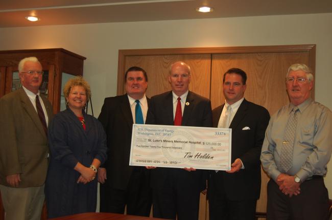 JOE PLASKO/TIMES NEWS Congressman Tim Holden, center, presented officials at St. Luke's Miners Memorial Hospital with a $525,000 check to support the hospital's Energy Efficiency Improvement Project today. Joining Holden are, from left to right,…