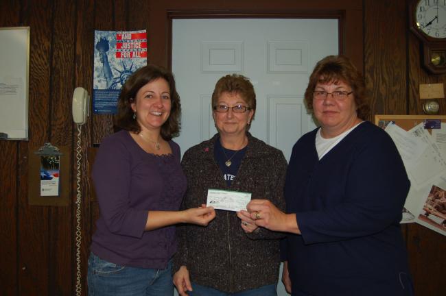 Gail Maholick/TIMES NEWS Members of Concerned Citizens of Weissport presented a check of $10,000 to Weissport Borough Council which served as seed money for the borough to receive a $48,000 grant from the state Department of Community and Natural…