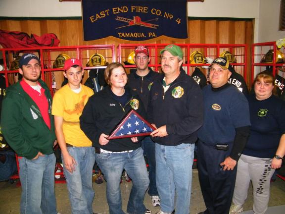 ANDREW LEIBENGUTH/SPECIAL TO THE TIMES NEWS Air Force Senior Airman Kailey Simmons of Tamaqua, presents her East End Fire Company with a memorial flag that was flown over Afghanistan as appreciation for their support for her while she was serving…