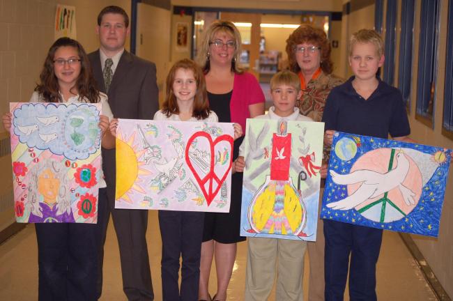 JOE PLASKO/TIMES NEWS Tamaqua Lions Club Peace Poster contest winners from Tamaqua Area Middle School included, front from left, Francesca DiFiore, third place, ages 12-13; Nicole Prantow, first place, age 11 and overall District winner; David…