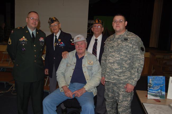 TERRY AHNER/TIMES NEWS Veterans who shared their stories with Palmerton Area High School students during an assembly Monday morning include (front row, seated) Earl Henning, and Timothy Kromer, and in the back row (l-r) Chuck Franisco, Al Kohler,…