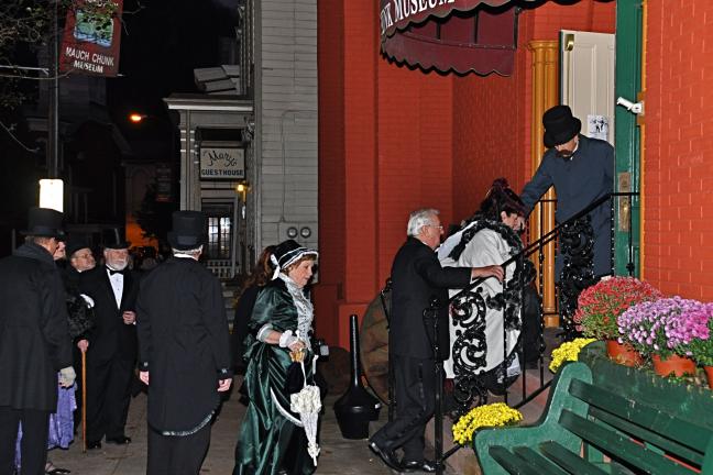 VICTOR IZZO/SPECIAL TO THE TIMES NEWS The gentlemen and ladies attired in their finest Victorian Era apparel who promenaded up and down the sidewalks of Broadway in Jim Thorpe last Saturday evening are seen entering the Mauch Chunk Museum & Cultural…