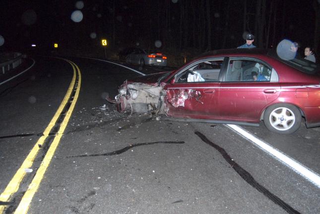 RON GOWER/TIMES NEWS Car of Karen Reehl sits in eastbound lane of Route 209 atop Bugzie's Hill in Summit Hill following accident in which a car allegedly crossed the center line of the roadway and struck her vehicle.