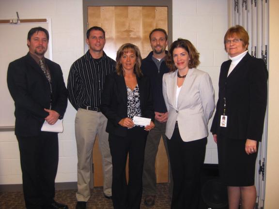 LIZ PINKEY/SPECIAL TO THE TIMES NEWS Members of the Panther Valley Foundation present the School District with a check to be used to continue supporting the Dual Enrollment program between high school students and LCCC. Pictured are (left to right)…