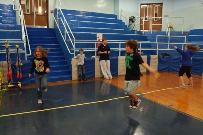 TERRY AHNER/TIMES NEWS S.S. Palmer Elementary fifth-grade student Andrew Ringler (center) gives his all as he jumps rope on Thursday as part of the district's Jump Rope For Heart program.
