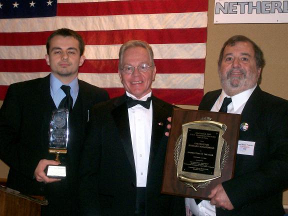 SPECIAL TO THE TIMES NEWS Mountain Karate Academy was presented two awards by the Eastern USA International Martial Arts Association. From left are, Master Paul Maglionico, Grandmaster John Kanzler, presenter; and Kyo Sa Nim Rich Maglionico.